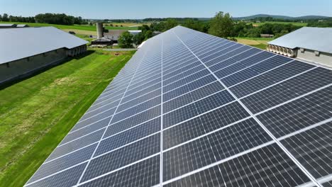 Aerial View of Large Solar Panel Array on a Rural Rooftop