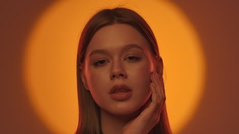 elegant portrait of a woman with dramatic lighting and expression the woman looks to the side with her head resting on her hand in dramatic lighting that perfectly emphasizes her facial expressions and features