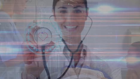 Animation-of-lines-and-heart-pulsating-over-happy-caucasian-female-doctor-with-stethoscope