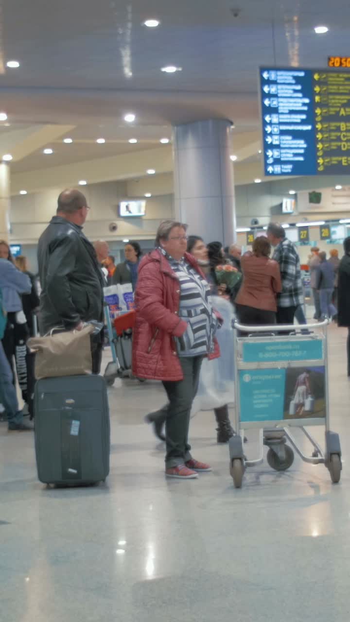 People at an airport terminal