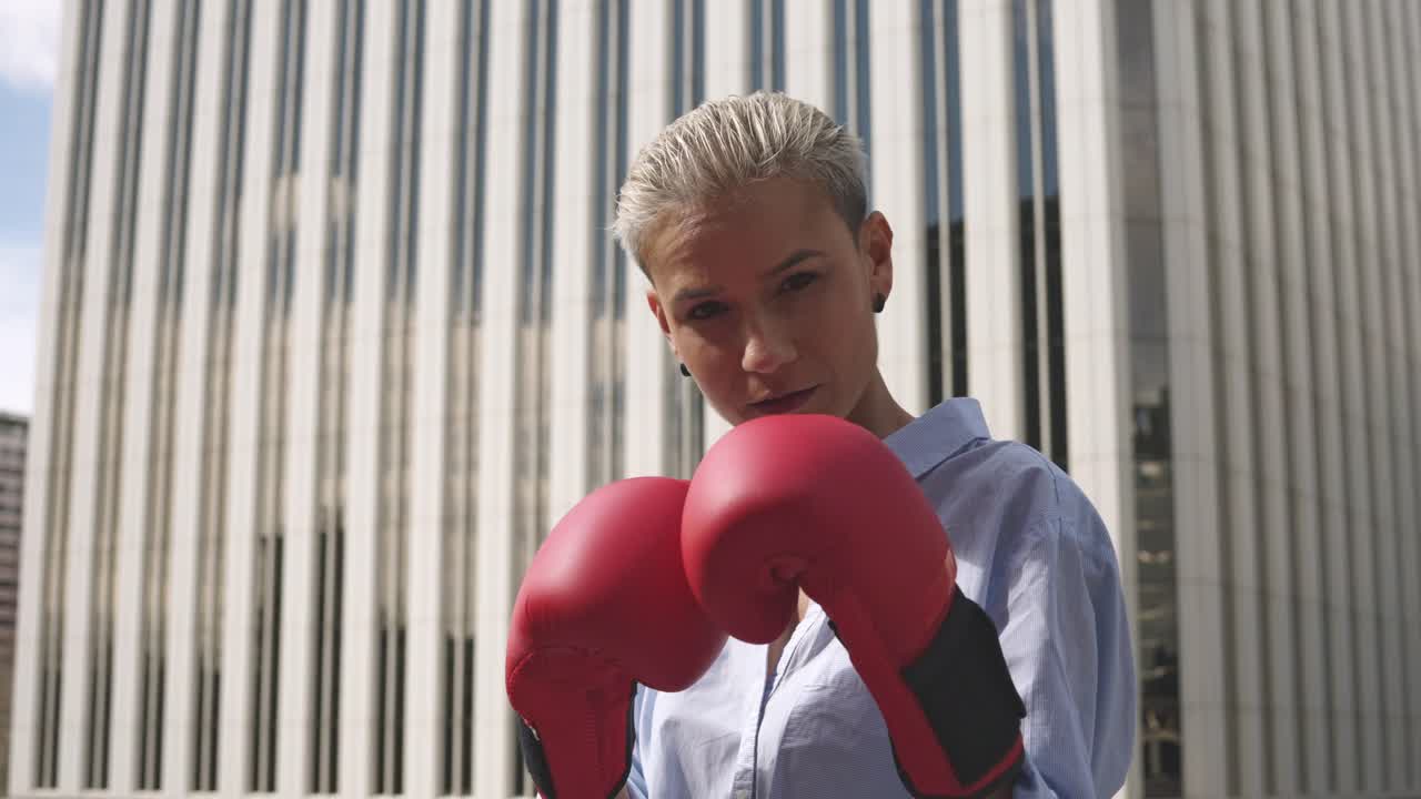 Woman in boxing gloves in the city