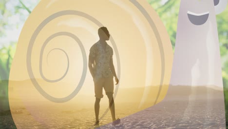 Animation-of-spiral-over-african-american-man-standing-on-beach