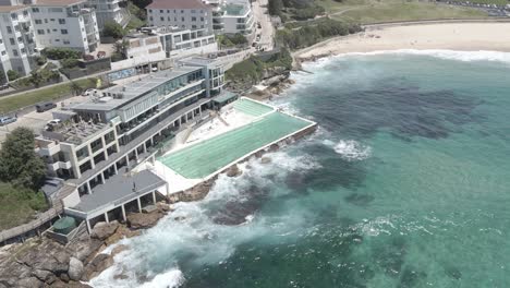 bondi icebergs pool with crashing waves in summer - bondi icebergs club, bistro and bar - nsw, australia