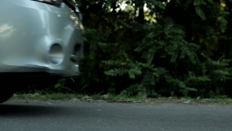 close up view of car suddenly applying brakes on road