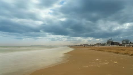 stormy beach with hotels in the background
