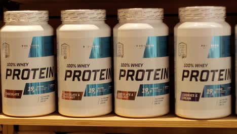 sport nutrition store interior with large choice of nutritional supplements.