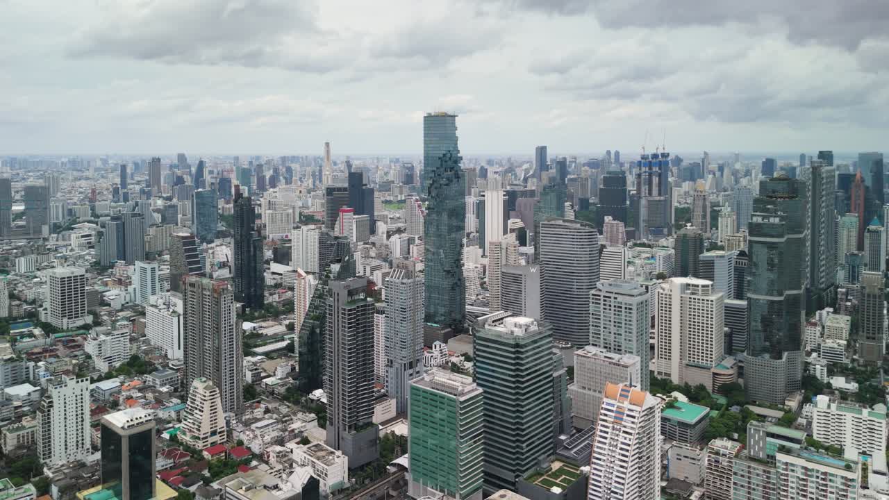 Aerial Drone View of Bangkok City Skyline with Modern Skyscrapers, Urban Growth, and Expanding Metropolitan Landscape
