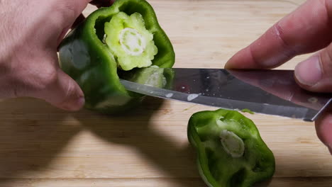 cutting a green bell pepper