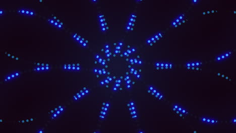 symmetrical blue dot pattern with glowing effect on dark background
