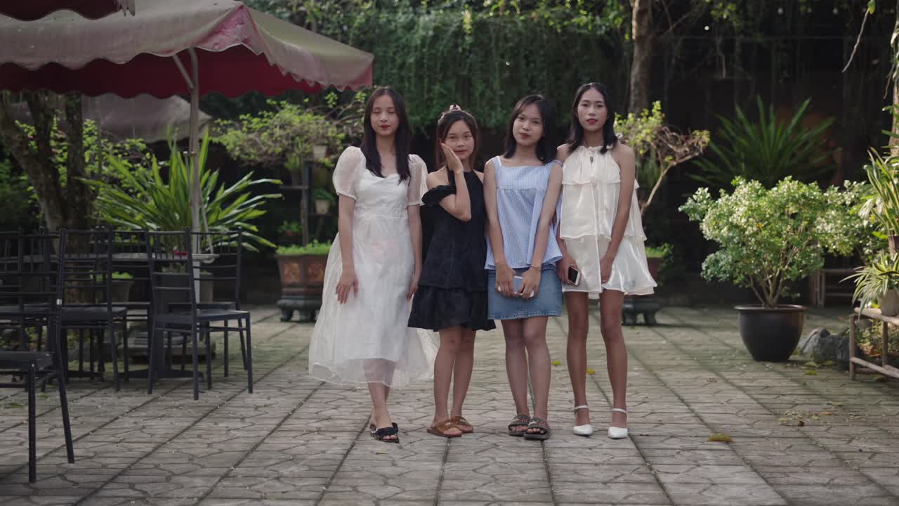 Four friends posing outdoors