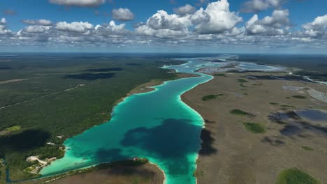 aerial view overlooking the lagoon of seven colors in sunny bacalar, mexico