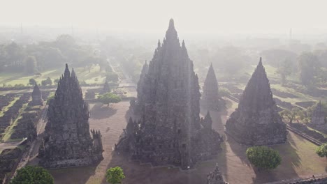 dreamy morning sunlight at holy prambanan hindu temple in indonesia, aerial