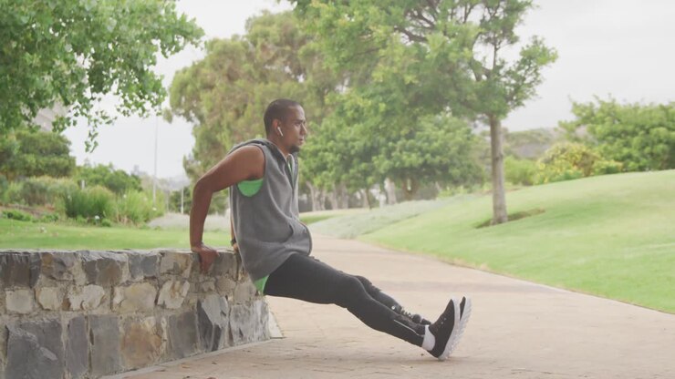 Side view man with prosthetic leg stretching