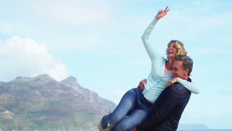 mature couple enjoying on beach