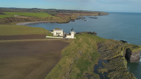 Aerial-view-of-Todd-Head-lighthouse-in-Aberdeenshire,-Scotland