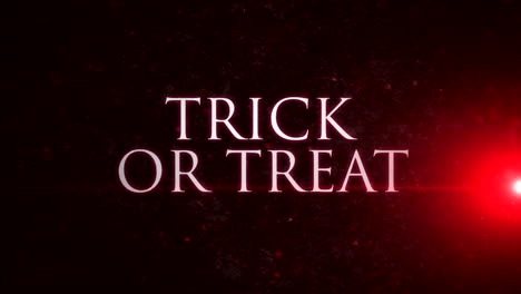 Trick-or-Treat-with-red-rays-on-dark-space