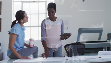 Animation-of-graphs,-bars-and-circles,-diverse-female-coworkers-discussing-floor-plan-on-blueprint