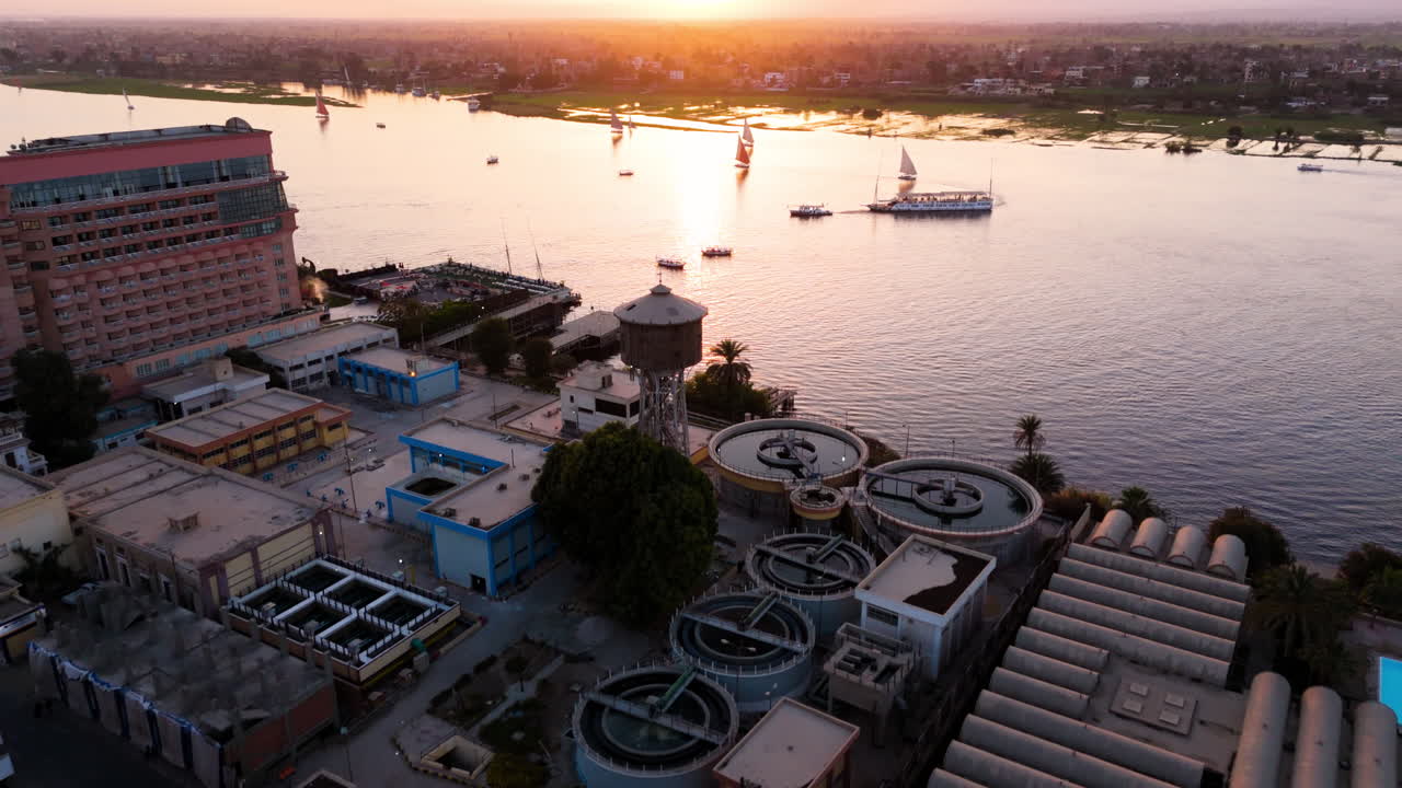 Wide view of felucca on Nile near Luxor temples