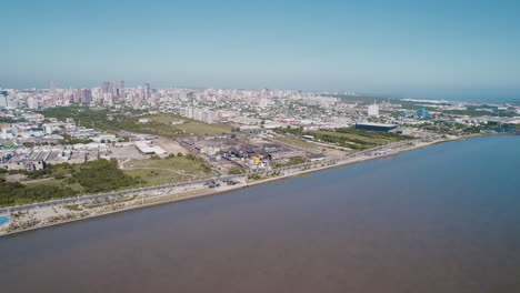 aerial view of malecon of the magdalena river with a huge city in background in barranquilla unfolds, a vibrant tapestry of life and culture along the riverbanks