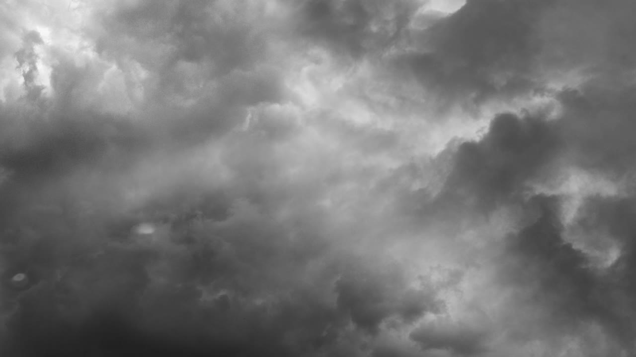 view of thunderstorm with lightning strikes and storm clouds