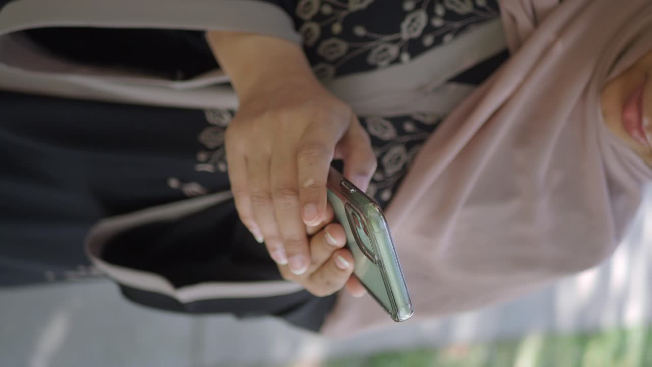 Close-up of a person holding and using a smartphone