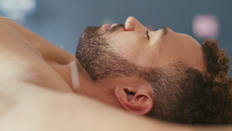 closeup of an acupuncture needle in client being