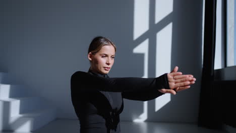 woman practicing yoga in a studio