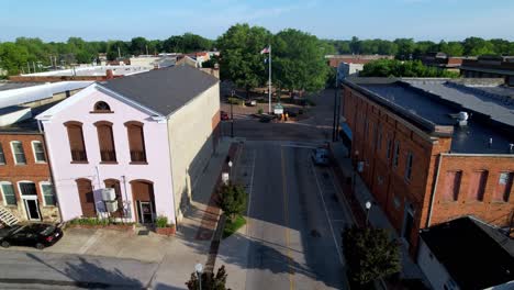 Abbeville-SC,-Abbeville-South-Carolina-aerial-approach-with-American-Flag-Flapping