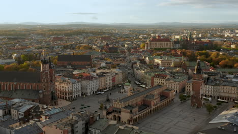 panorama of soft lighted main square in krakow, old town and wawel royal castle at beautiful morning, krakow, poland - slow movement