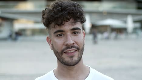 handsome young man looking at camera