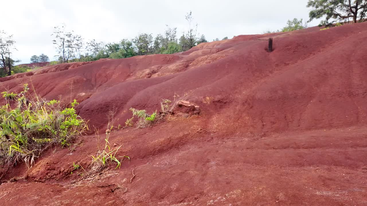 red dirt in Waimea canyon in kauai, hawaii. The famous Red Dirt Falls, a cascading waterfall of fresh water in Waimea Canyon State Park, located on the island of Kauai, Hawaii