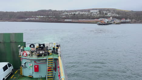 a passenger ferry leaving the port of rothesay on the island of bute in scotland, united kingdom.