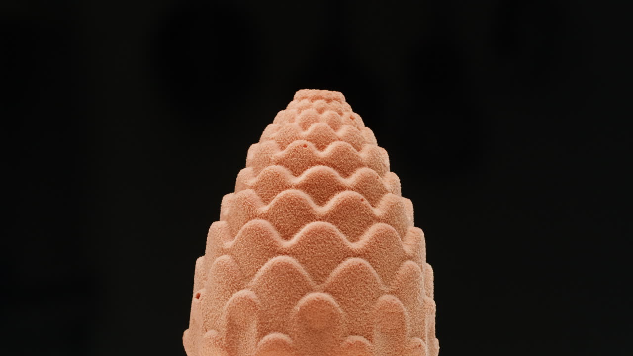 Close-up of a Decorative Pink Pinecone Cake Topper