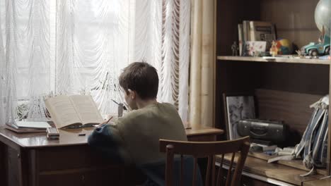 boy studying at home