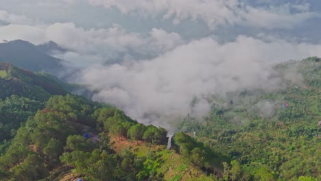 drone video captures the stunning manakamana hill in gorkha, nepal—home to the sacred hindu temple, surrounded by dramatic hilltop views, traditional villages, and a famous cable car route