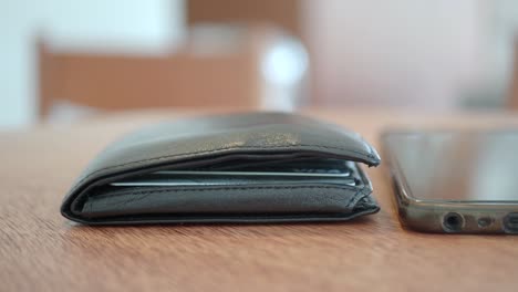 wallet and smartphone on a table