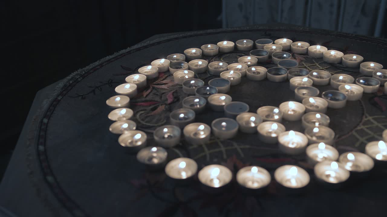Candle Lit Pentagram On Table Inside Creepy Dark Bedroom. Follow Shot