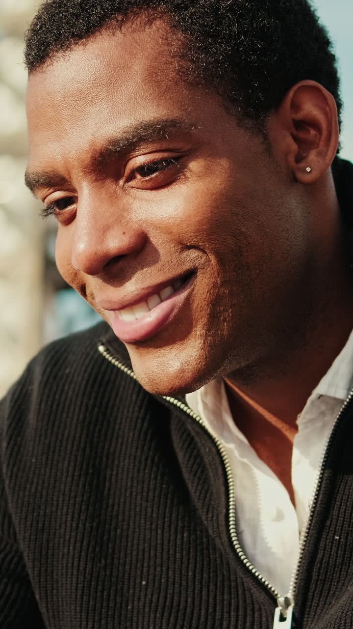 Close-up of Happy Young Man Smiling at Camera
