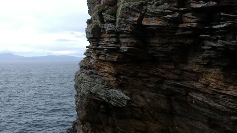 Panning-drone-shot-of-ocean-cliffs