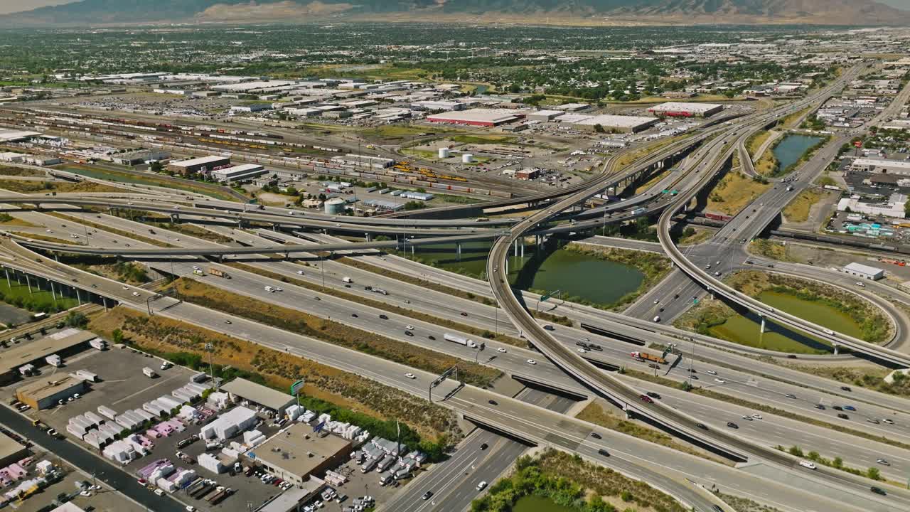 Traffic crossing on complex highway with downtown cityscape