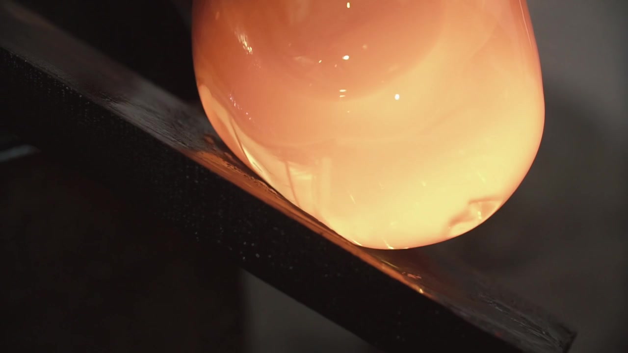 Close-up of Molten Glass Being Shaped by a Glass Blower