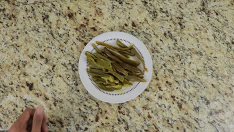 Bowl-of-green-jalapeno-peppers-in-strips,-overhead-view