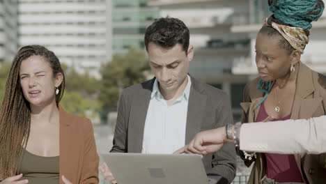 front view of focused coworkers working together outdoor