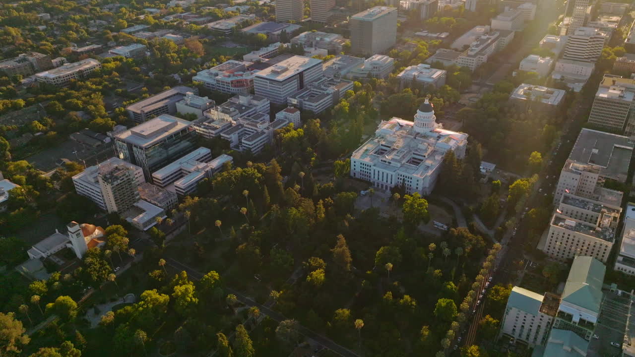 Urban panorama of Sacramento, California, USA. Green cozy city from aerial perspective on sunny day.