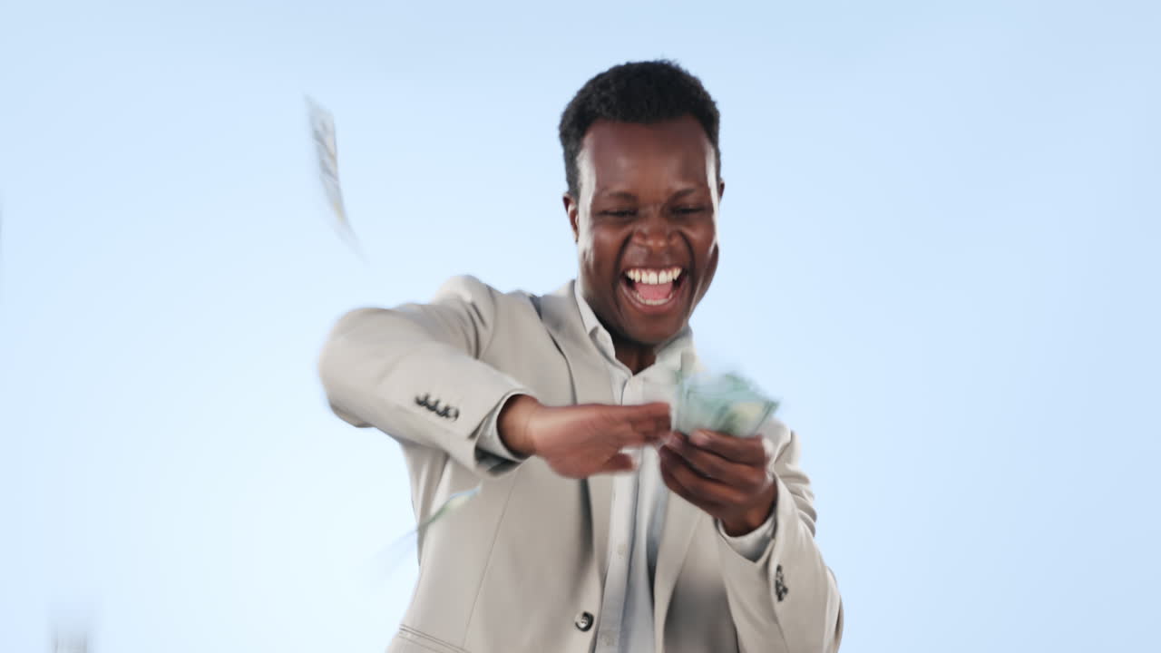 Premium stock video - Happy black man, money rain