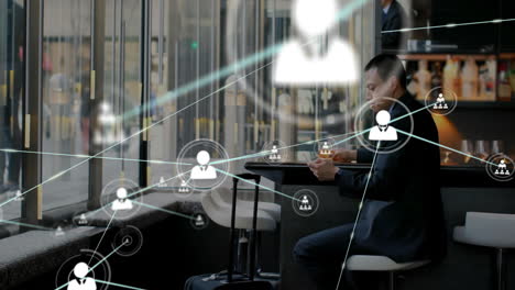 animation of network of connections over caucasian man using smartphone in office