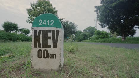 highway milestone showing distance of kiev