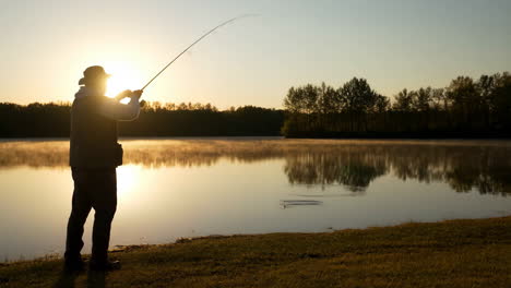 man fishing at sunset