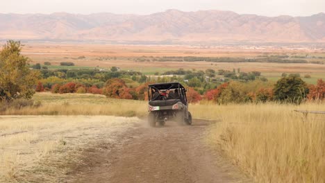 ranger four wheeler driving down a path in the utah mountains in the fall 1080p 60fps