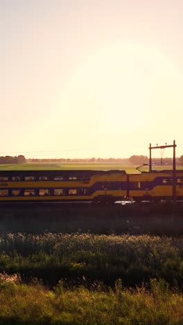 train through the countryside at sunrise/sunset